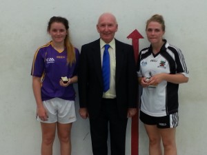 Women's Junior Singles winner Holly Hynes pictured with runnerup Tanya O'Toole and County Chairperson Tom Rossiter