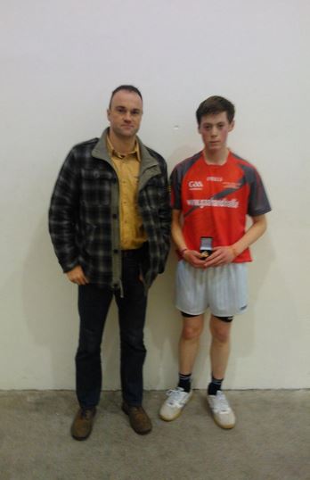 Keith Armstrong, FCJ Bunclody receiving his All Ireland colleges 60x30 senior singles medal from GAA Handball representative Aengus Cunningham at St. Comans Roscommon