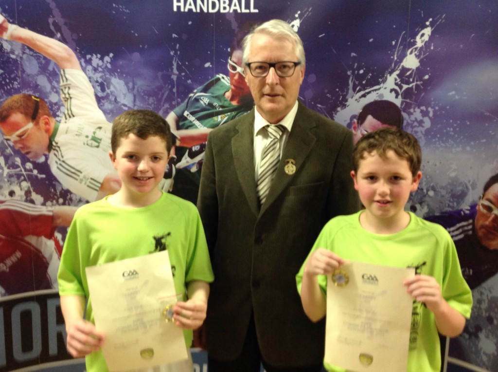 National under 13 doubles school champions Mark and Conor with GAA Handball President, Willie Roche