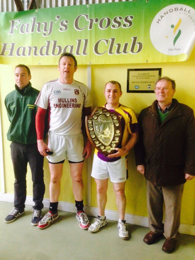 Curly Lambert with the prestigious Junior Singles shield following his win over Kevin Craddock, Galway. Also in the picture is official-in-charge David Hope and Offaly legend Pat Masterson. 