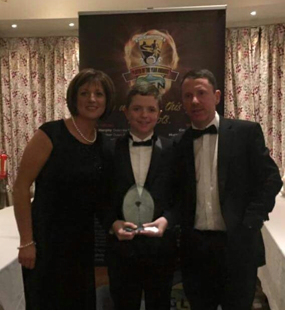 Proud parents Helen and Robert Doyle with their son Mark, the Glen Fuels Handballer of the Year for 2015
