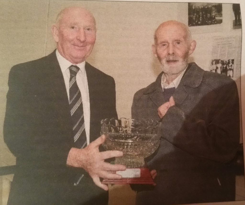 Brian Murphy being presented with his appreciation award by Club Chairperson Tom Rossiter
