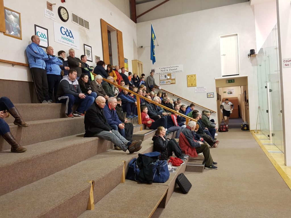A section of the attendance at last night's county senior singles final at St. Josephs Community Centre. Champion Gavin Buggy can be seen entering the arena to begin his defence of the title. 